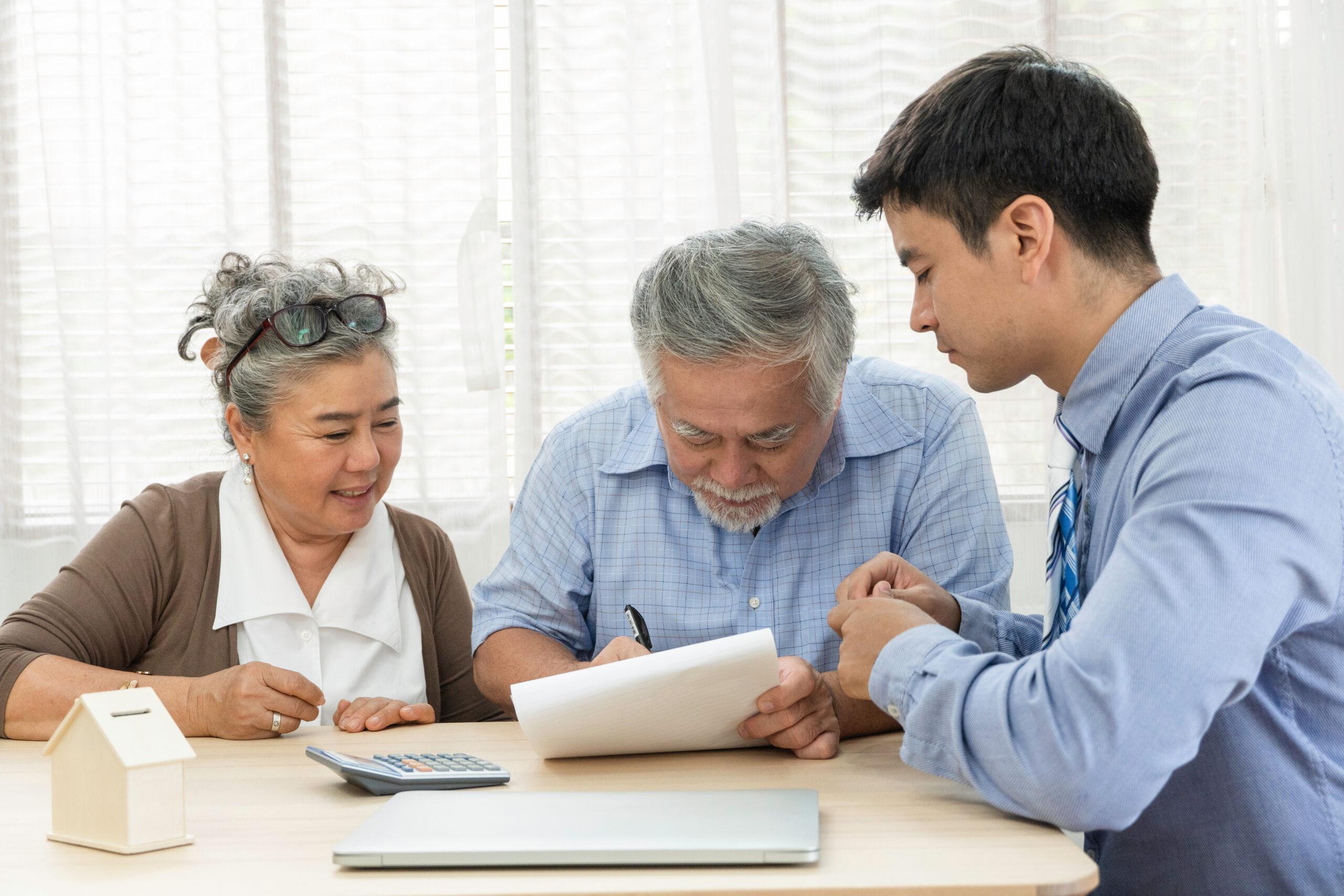 Senior couple planning with the help of a financial planner