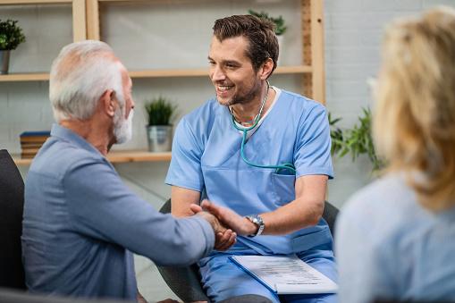 Patient in General Practice shaking hands with doctor