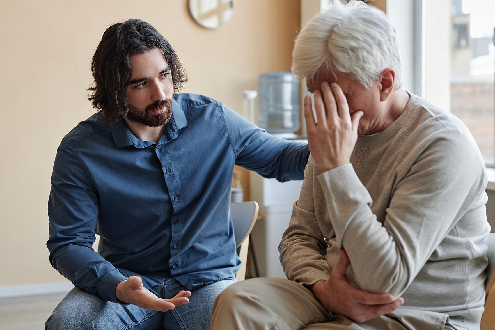Man supporting parent with dementia